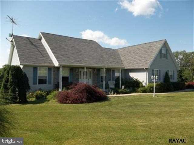 3008 Bowser Road New Freedom, PA 17349 - Photo 2 of 36 a front view of a house with a garden