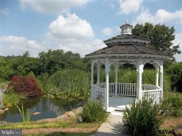 3008 Bowser Road New Freedom, PA 17349 - Photo 11 of 36 a view of a garden from a lake