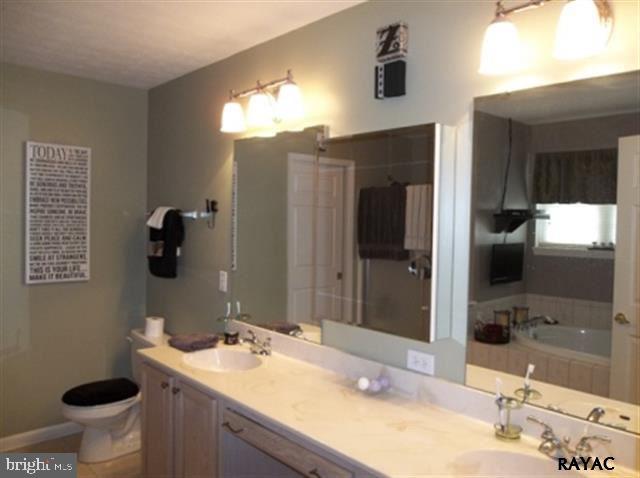 3008 Bowser Road New Freedom, PA 17349 - Photo 23 of 36 a bathroom with a sink and a mirror