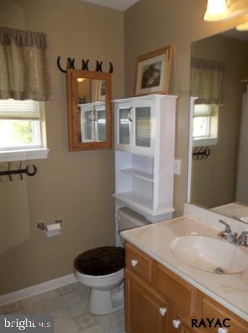 3008 Bowser Road New Freedom, PA 17349 - Photo 26 of 36 a bathroom with a granite countertop sink and a toilet