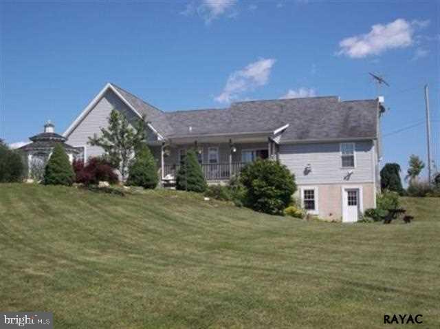 3008 Bowser Road New Freedom, PA 17349 - Photo 4 of 36 a front view of a house with a yard