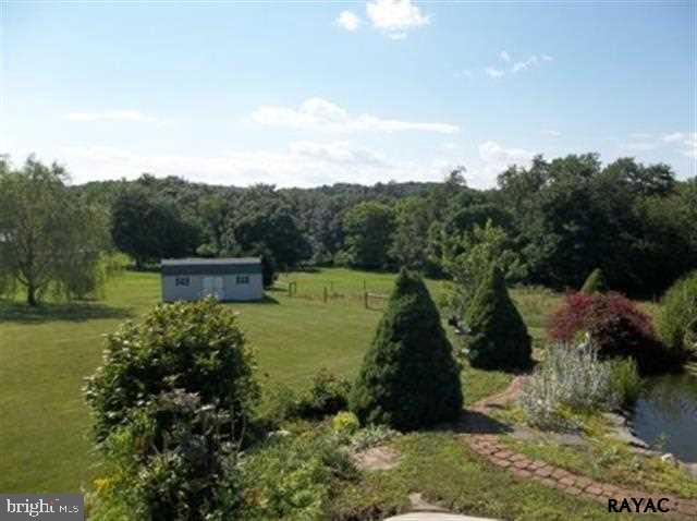 3008 Bowser Road New Freedom, PA 17349 - Photo 36 of 36 a view of a garden with a lake