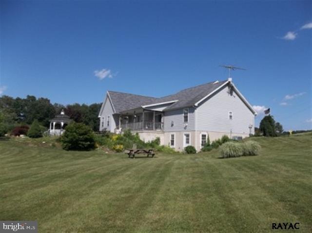 3008 Bowser Road New Freedom, PA 17349 - Photo 5 of 36 a view of a house with a yard