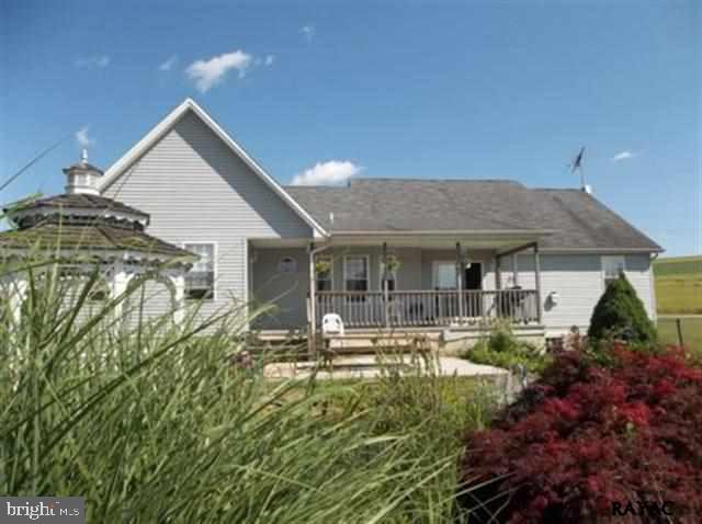 3008 Bowser Road New Freedom, PA 17349 - Photo 7 of 36 a front view of house with yard and outdoor seating