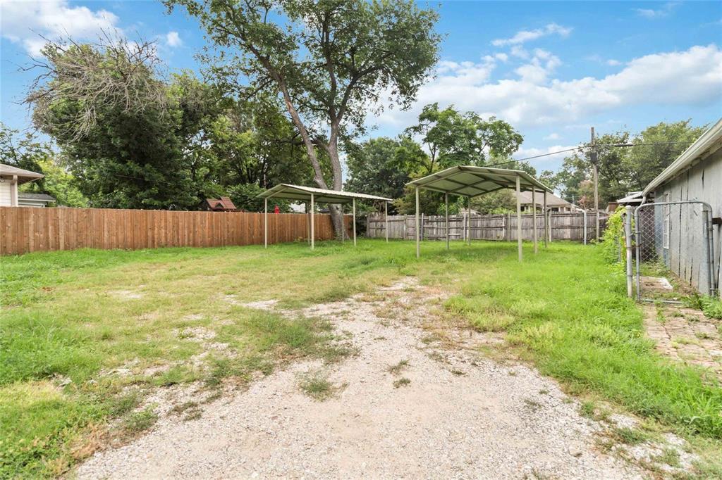 5524 Junius Street Dallas, TX 75214 - Photo 22 of 22 a view of a backyard with a small cabin