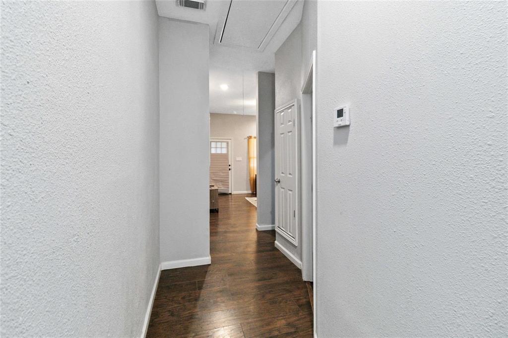 5524 Junius Street Dallas, TX 75214 - Photo 6 of 22 a view of a hallway with wooden floor