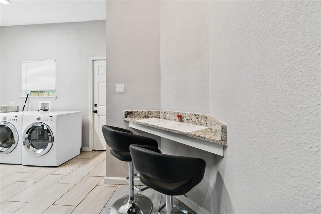 5524 Junius Street Dallas, TX 75214 - Photo 7 of 22 a utility room with dryer and washer