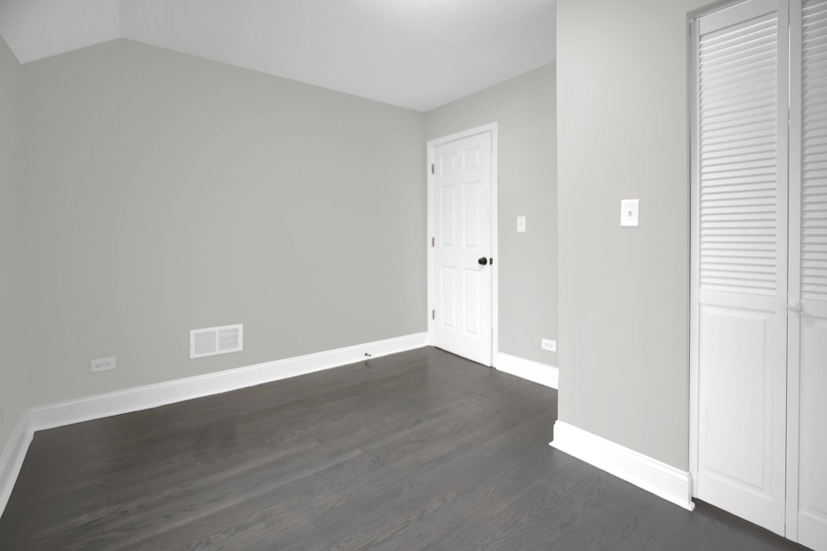 5219 West Monroe Street Chicago, IL 60644 - Photo 12 of 23 a view of an empty room with wooden floor