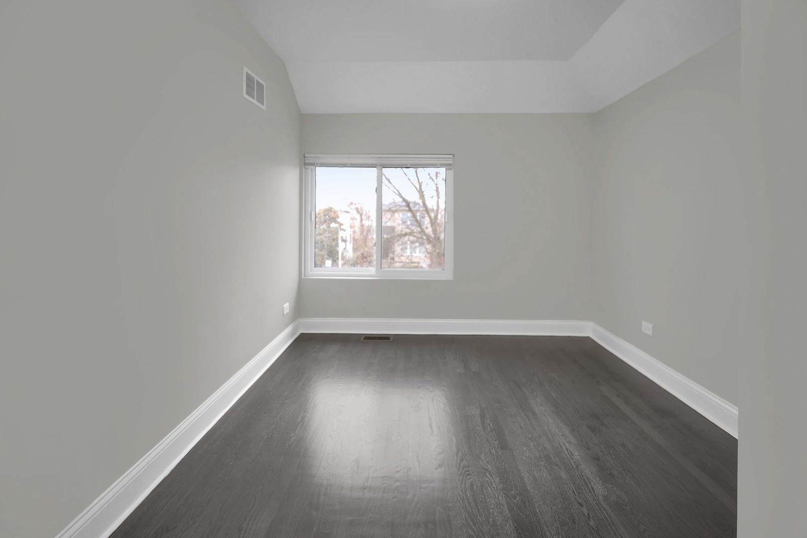 5219 West Monroe Street Chicago, IL 60644 - Photo 17 of 23 an empty room with wooden floor and windows