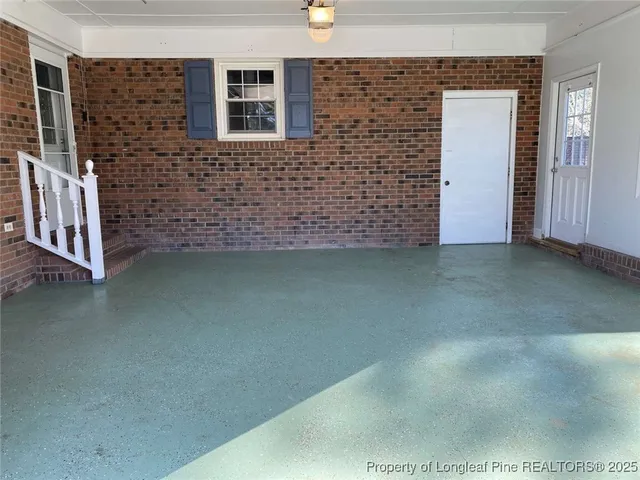 a view of outdoor space with deck and trees