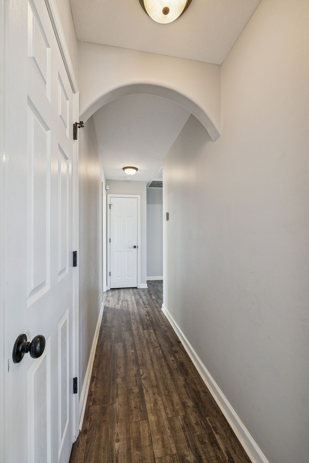 3760 Suiter Road Clarksville, TN 37040 - Photo 14 of 39 a view of a hallway with wooden floor and a ceiling fan