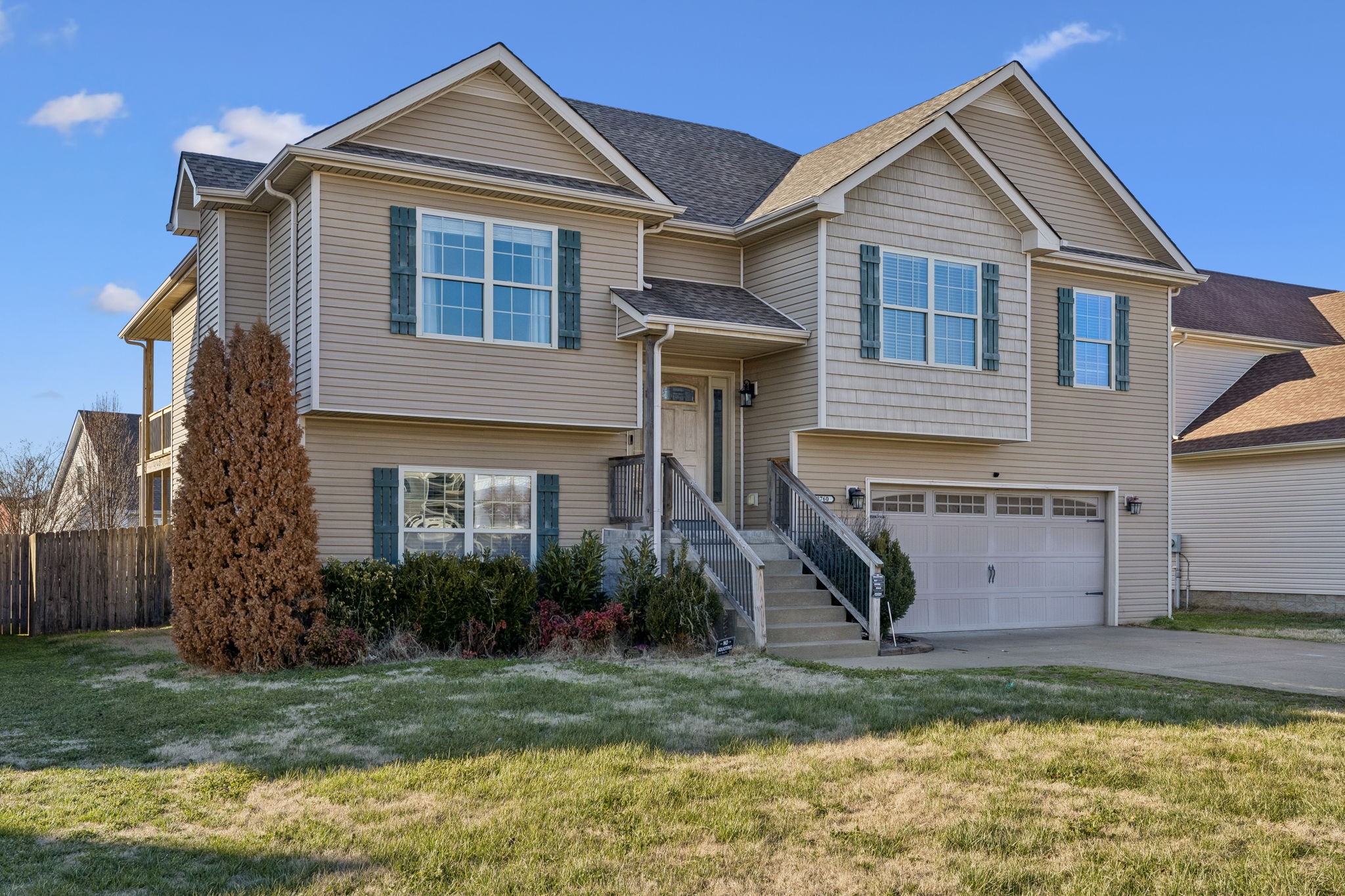 3760 Suiter Road Clarksville, TN 37040 - Photo 2 of 39 a view of a yard in front of a house with large windows