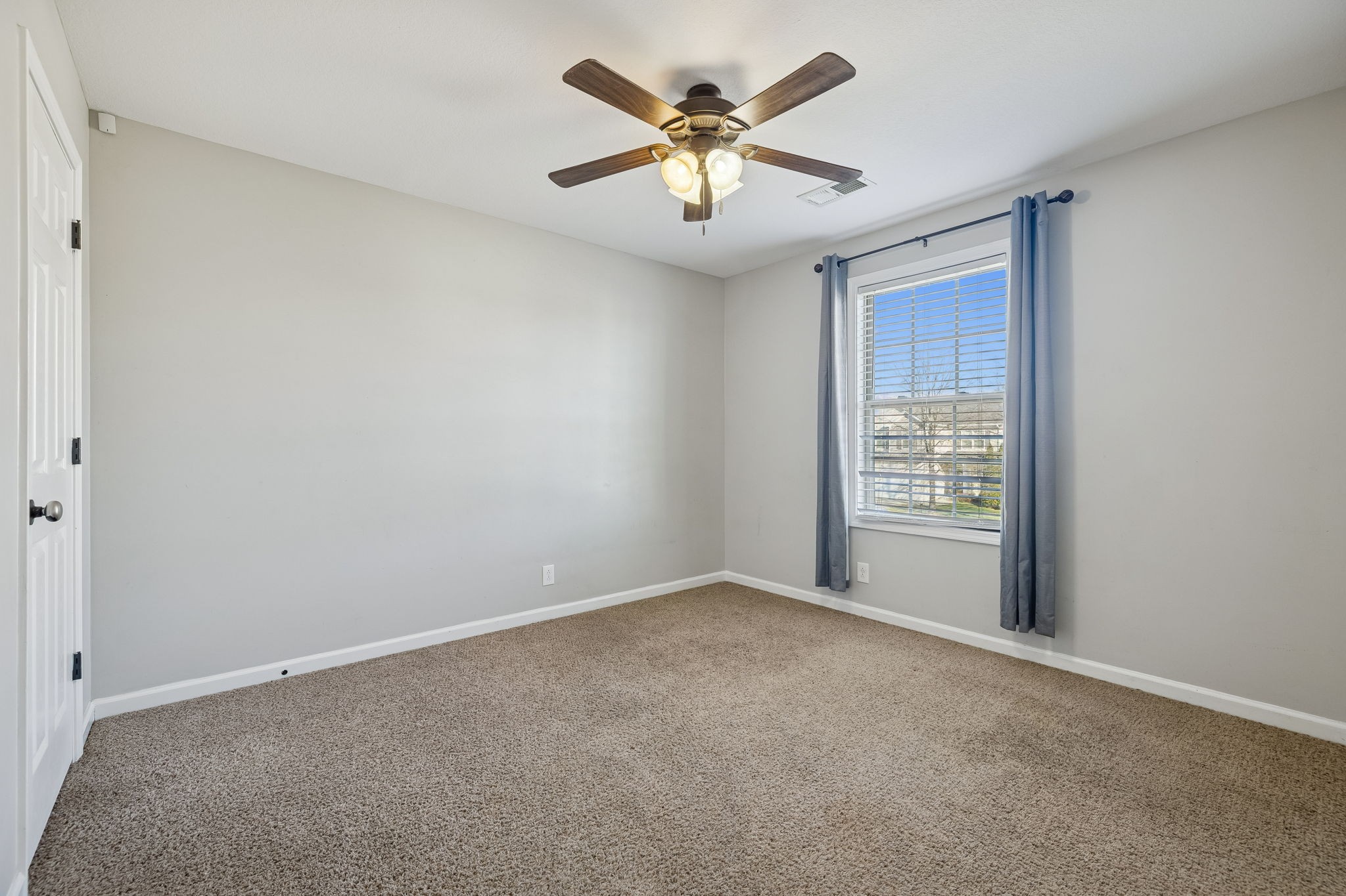 3760 Suiter Road Clarksville, TN 37040 - Photo 22 of 39 an empty room with windows and fan
