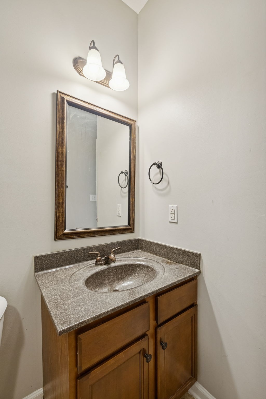 3760 Suiter Road Clarksville, TN 37040 - Photo 31 of 39 a bathroom with a granite countertop sink a mirror and a