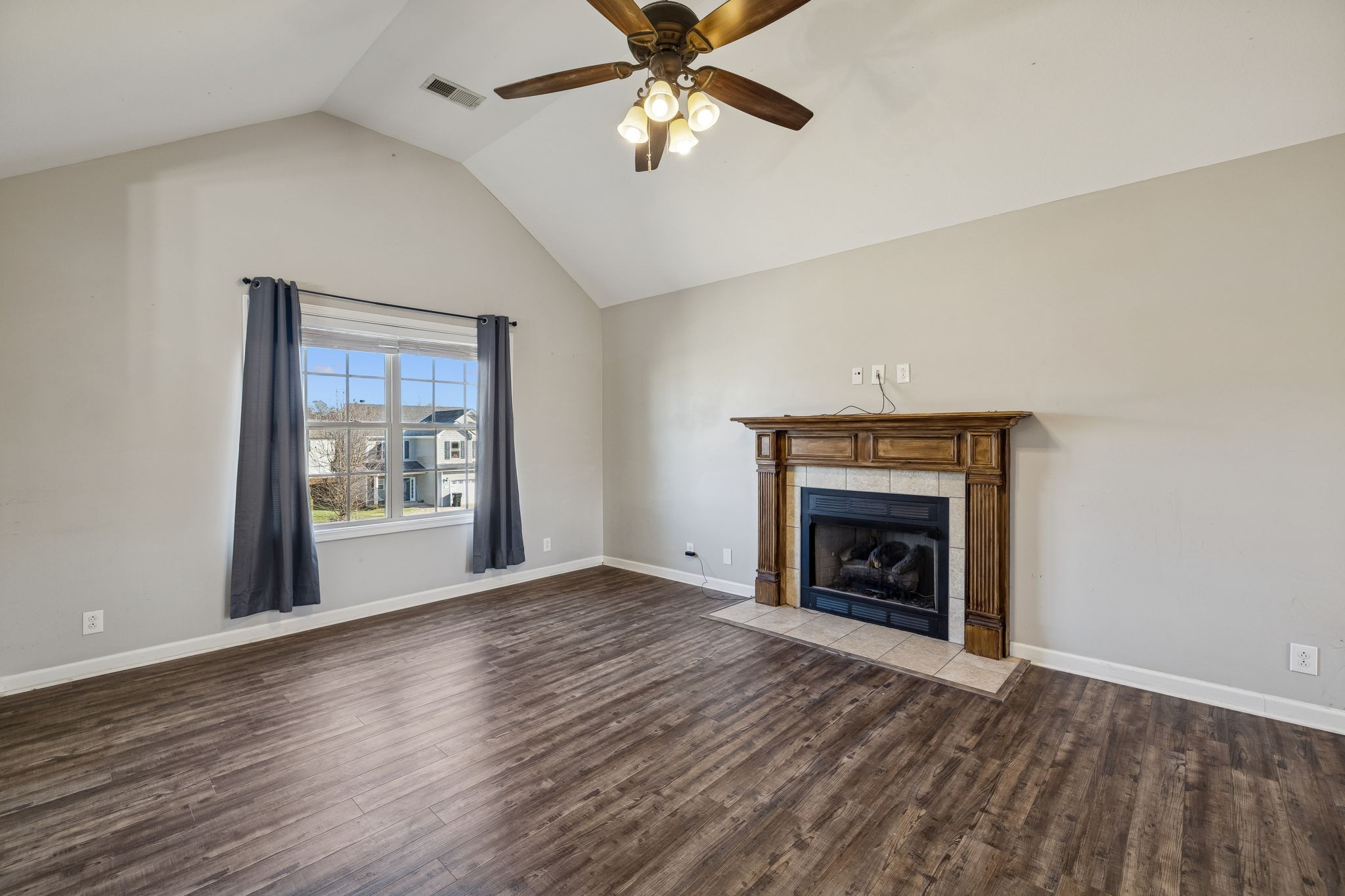 3760 Suiter Road Clarksville, TN 37040 - Photo 6 of 39 wooden floor fireplace and windows in an empty room