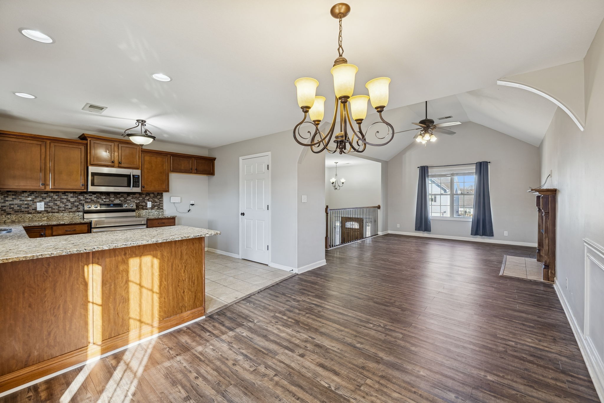 3760 Suiter Road Clarksville, TN 37040 - Photo 10 of 39 a view of a kitchen with stove and wooden floor