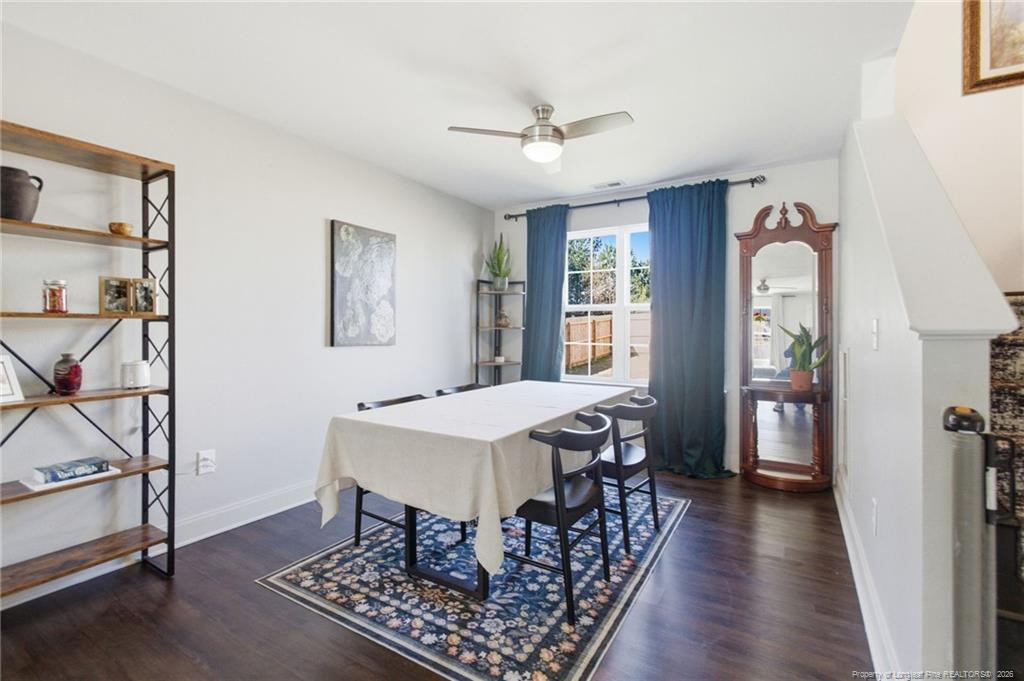 334 Crane Way Bunnlevel, NC 28323 - Photo 9 of 45 a view of a dining room with furniture window and wooden floor