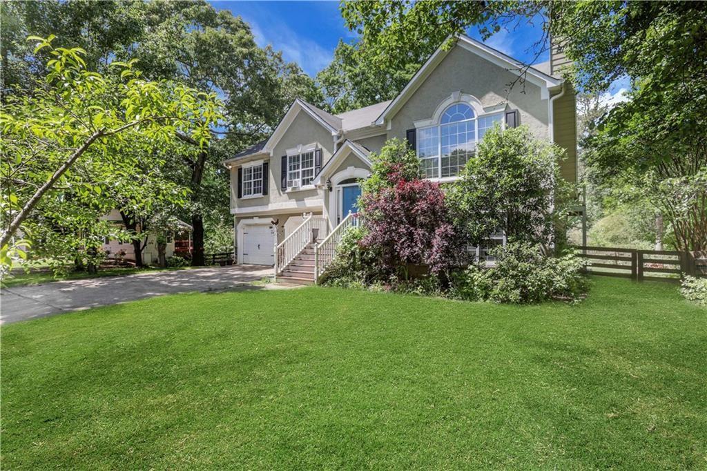 3820 Pheasant Run Trace Cumming, GA 30028 - Photo 4 of 16 a front view of house with yard and green space