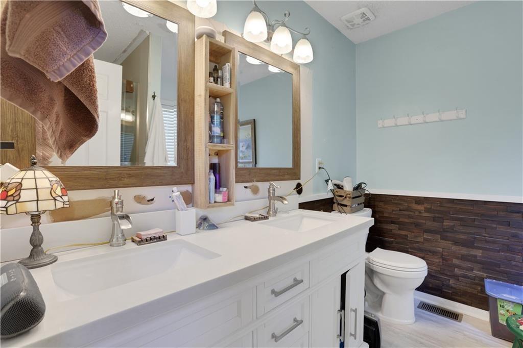 3820 Pheasant Run Trace Cumming, GA 30028 - Photo 10 of 16 a bathroom with a sink and a mirror