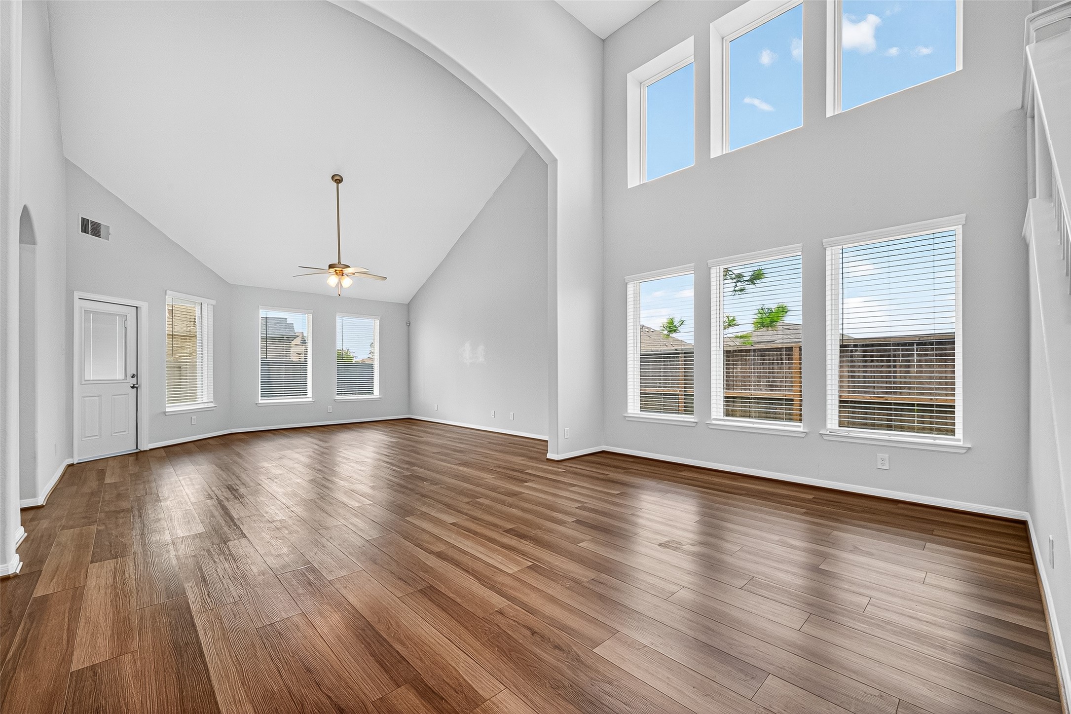 10511 Amador Peak Drive Rosharon, TX 77583 - Photo 12 of 41 a view of an empty room with wooden floor and a window