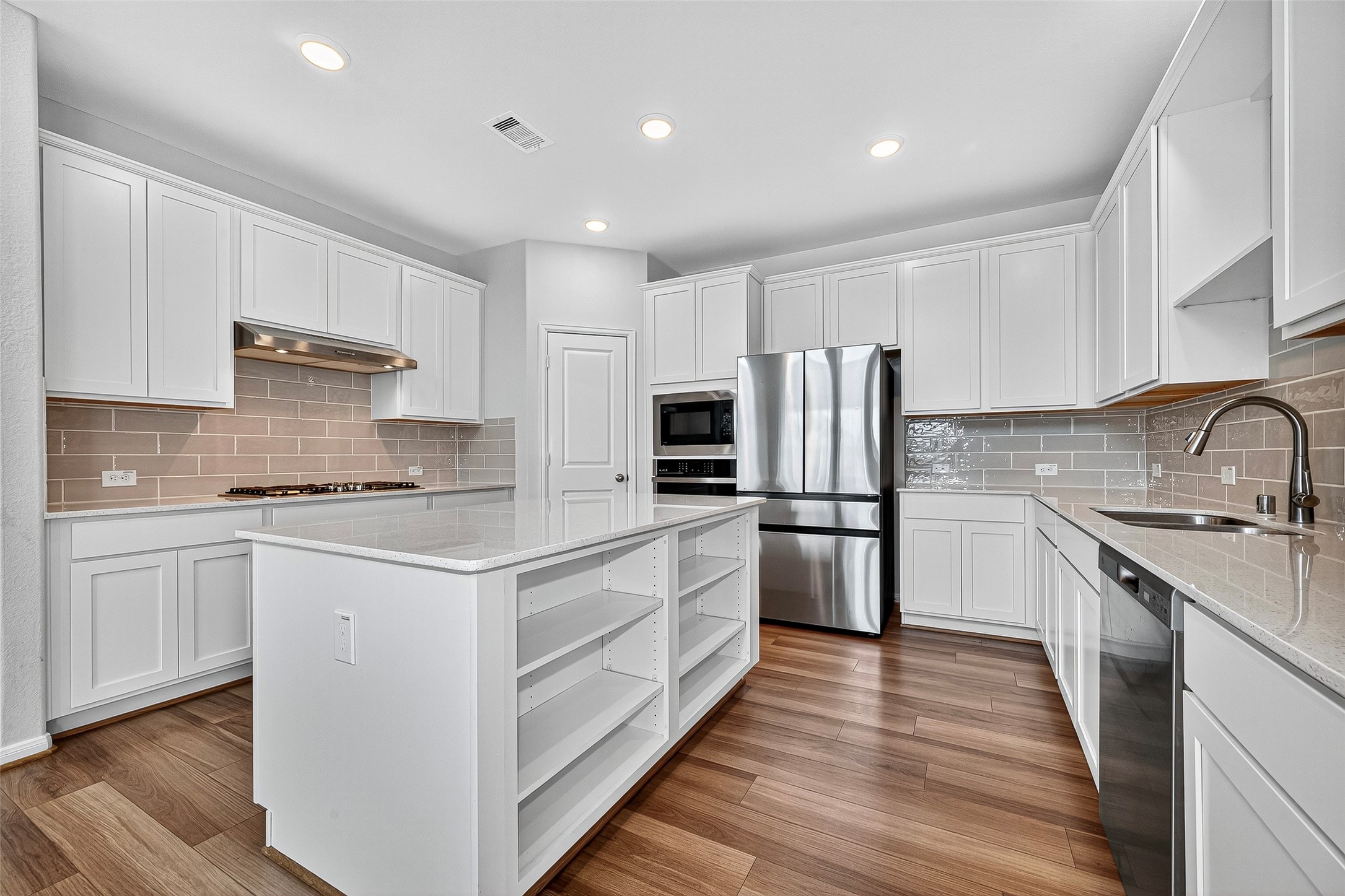 10511 Amador Peak Drive Rosharon, TX 77583 - Photo 16 of 41 Island kitchen with stainless steel appliances