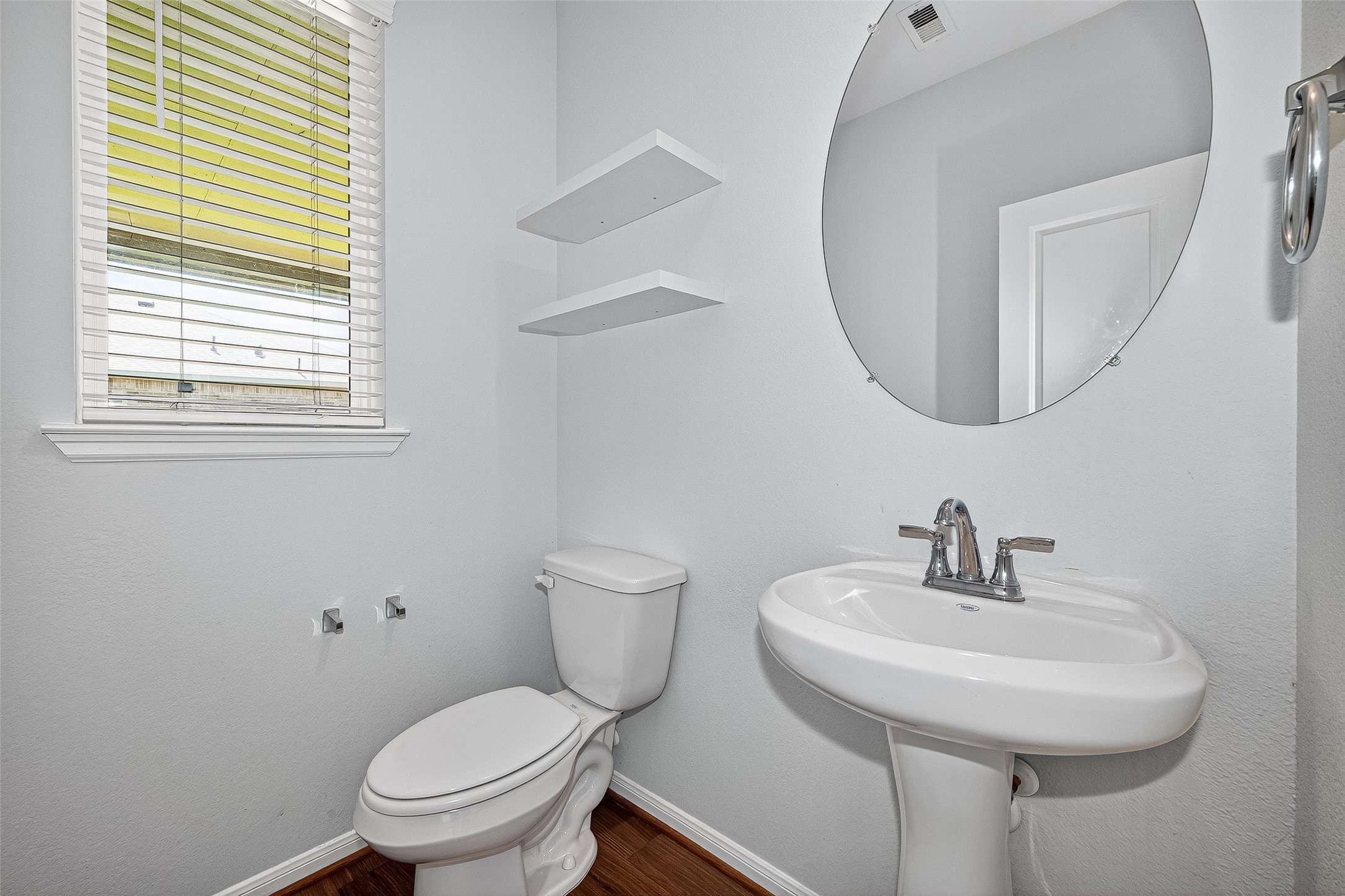 10511 Amador Peak Drive Rosharon, TX 77583 - Photo 23 of 41 a bathroom with a toilet a sink and a mirror