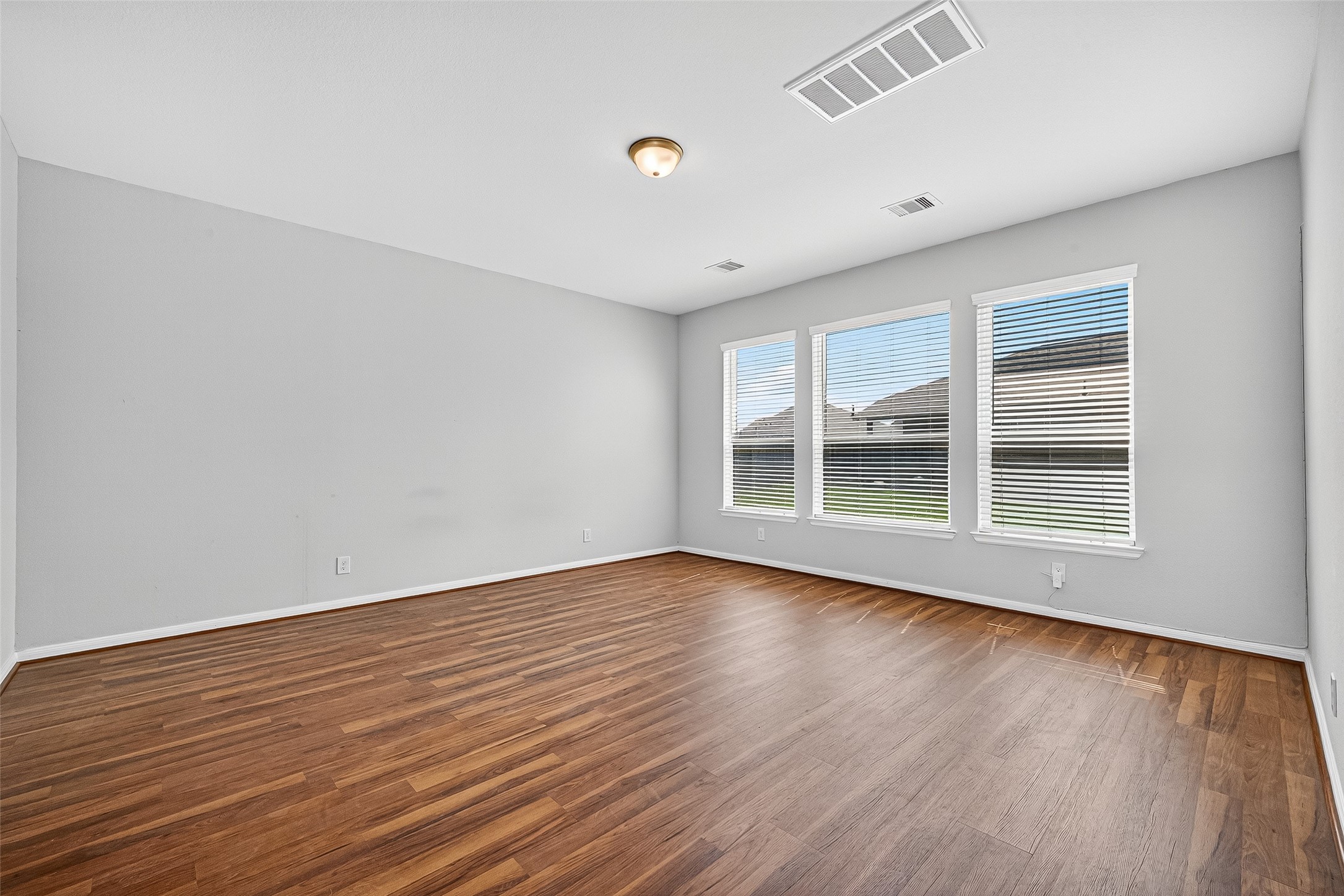 10511 Amador Peak Drive Rosharon, TX 77583 - Photo 25 of 41 a view of wooden floor and windows in a room