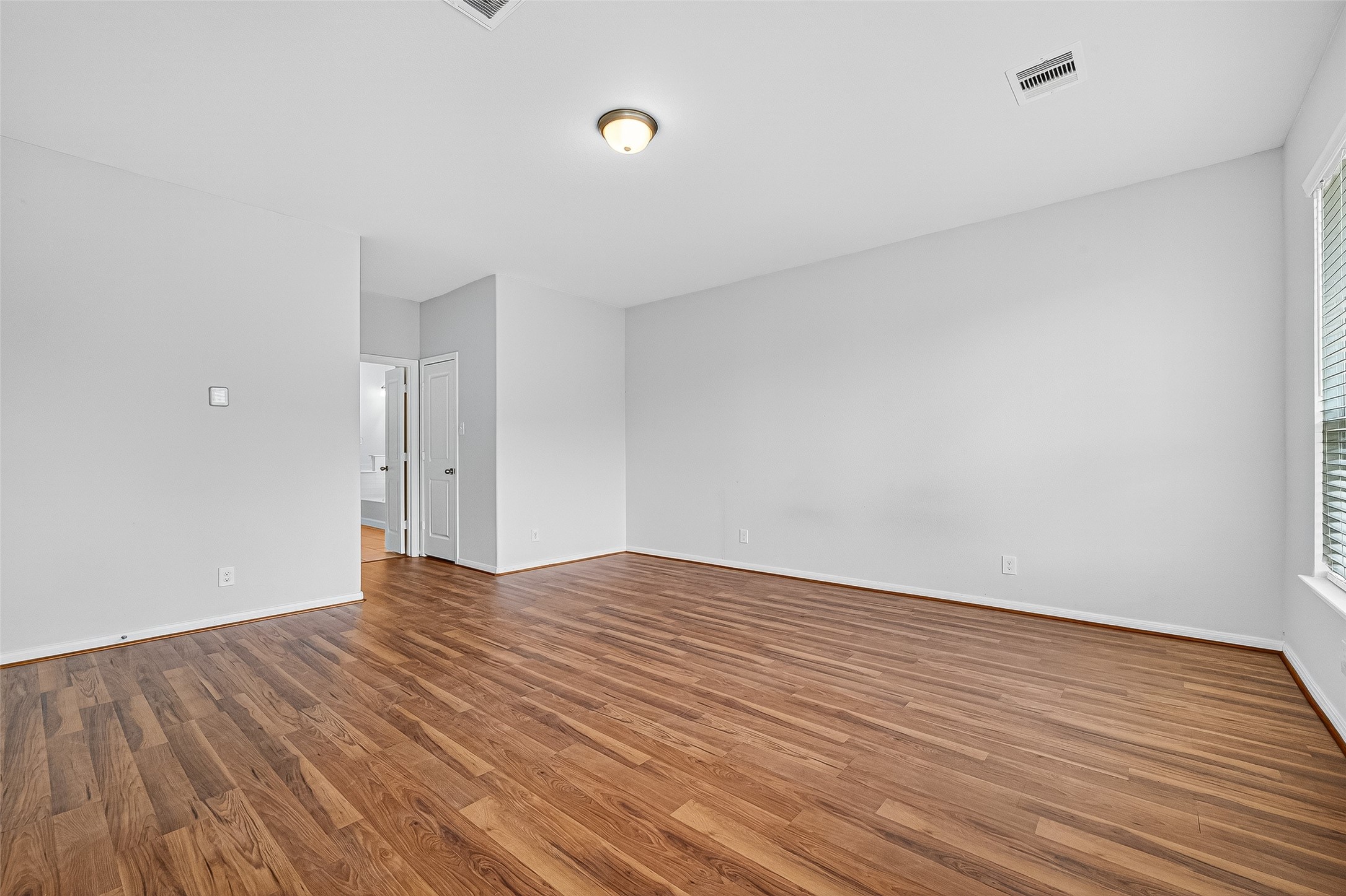 10511 Amador Peak Drive Rosharon, TX 77583 - Photo 26 of 41 a view of an empty room and wooden floor