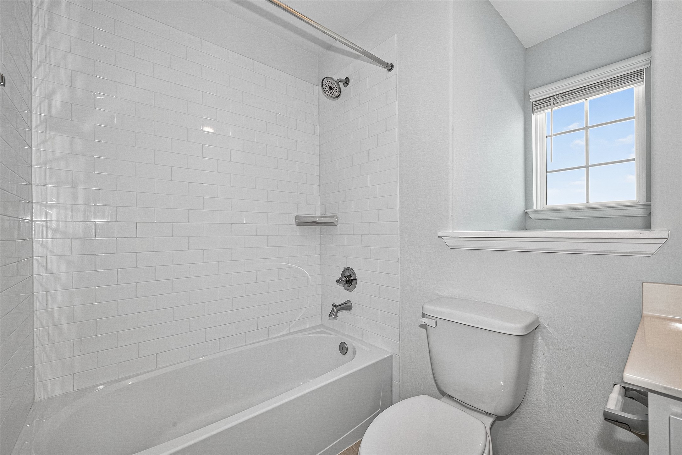 10511 Amador Peak Drive Rosharon, TX 77583 - Photo 36 of 41 a bathroom with a toilet and a bathtub