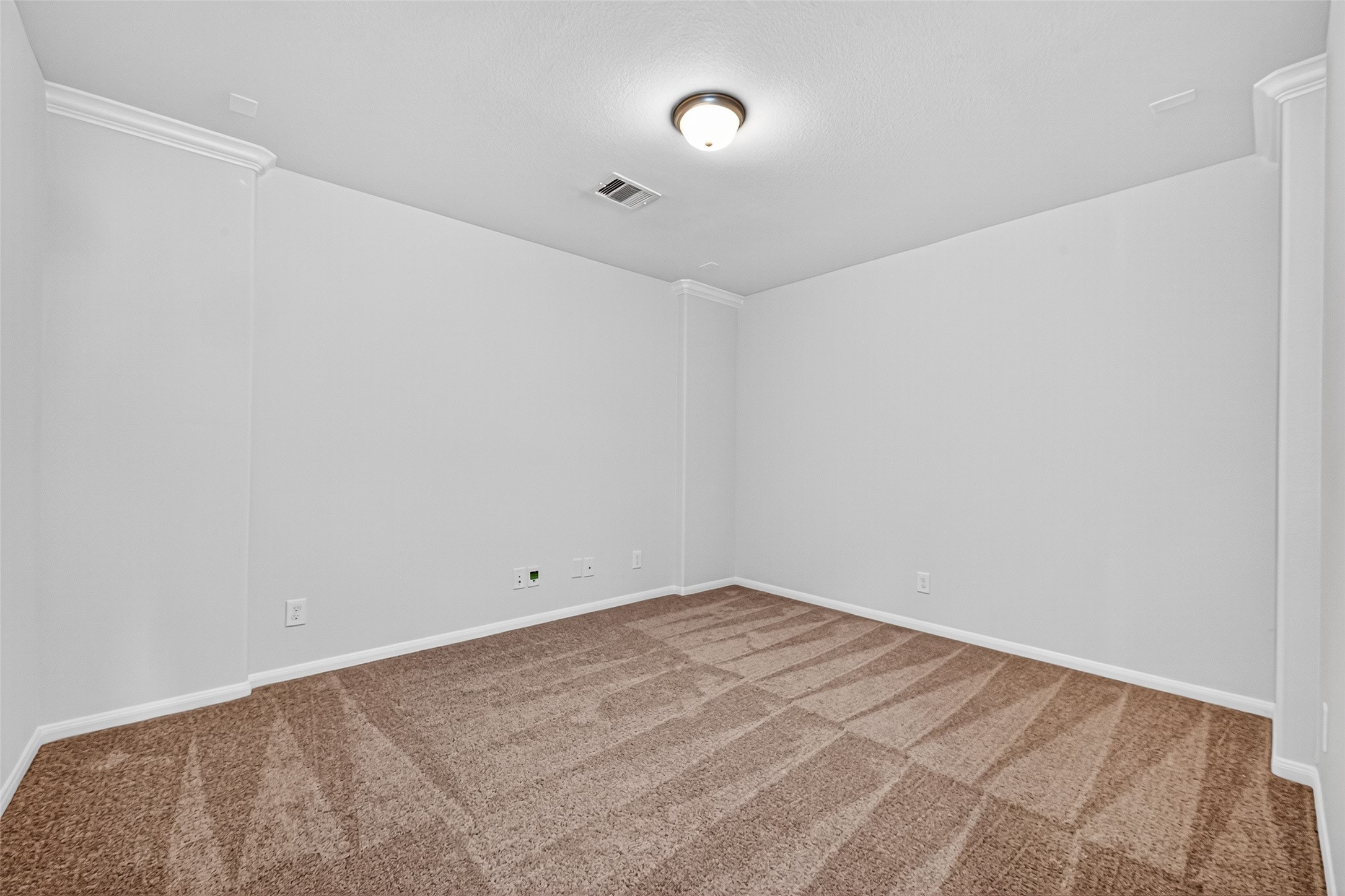 10511 Amador Peak Drive Rosharon, TX 77583 - Photo 37 of 41 Media room with neutral walls and plush carpeting