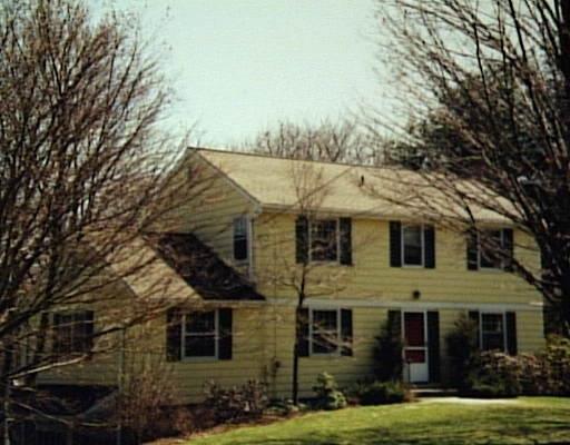 22 Boulder Hill Road Ridgefield, CT 06877 - Photo 1 of 1 front view of a house with a yard