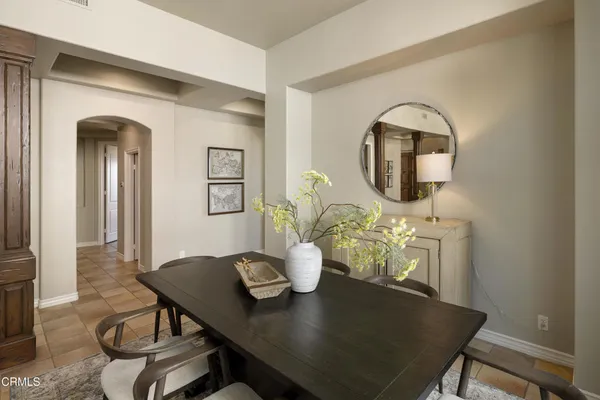 a living room with furniture and large windows