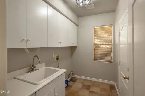 an aerial view of a house with outdoor space and street view