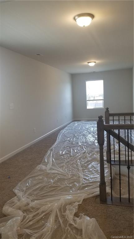 6540 Georgia Oak Road, Unit 84 Charlotte, NC 28269 - Photo 2 of 8 a view of a livingroom with wooden floor