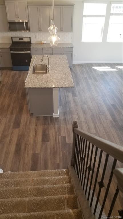 6540 Georgia Oak Road, Unit 84 Charlotte, NC 28269 - Photo 6 of 8 a view of a kitchen counter top space