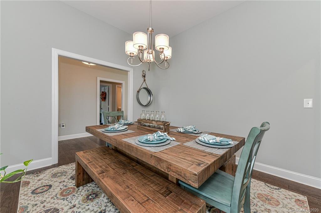 3113 East Brief Road Monroe, NC 28110 - Photo 8 of 42 a view of a dining room with furniture