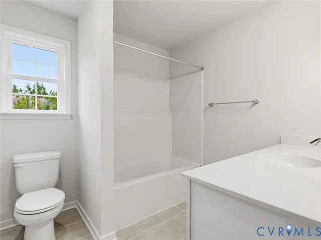 a view of wooden floor and windows in a room
