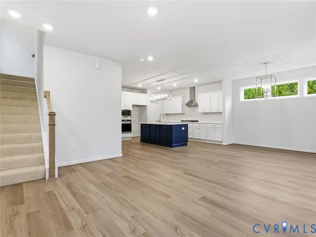 a view of kitchen and wooden floor