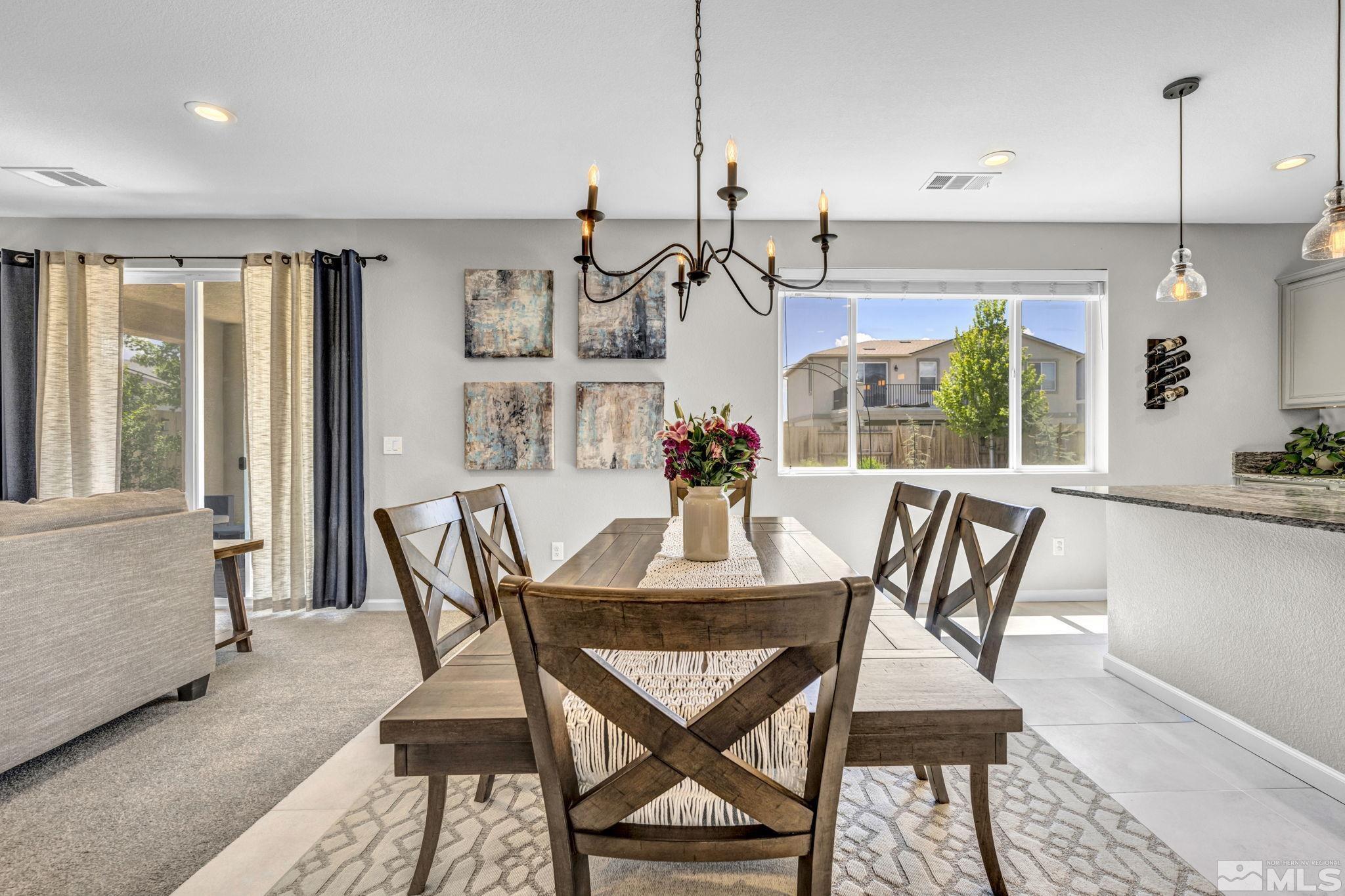 2265 Selway Drive Sparks, NV 89436 - Photo 13 of 39 a view of a dining room with furniture window and wooden floor