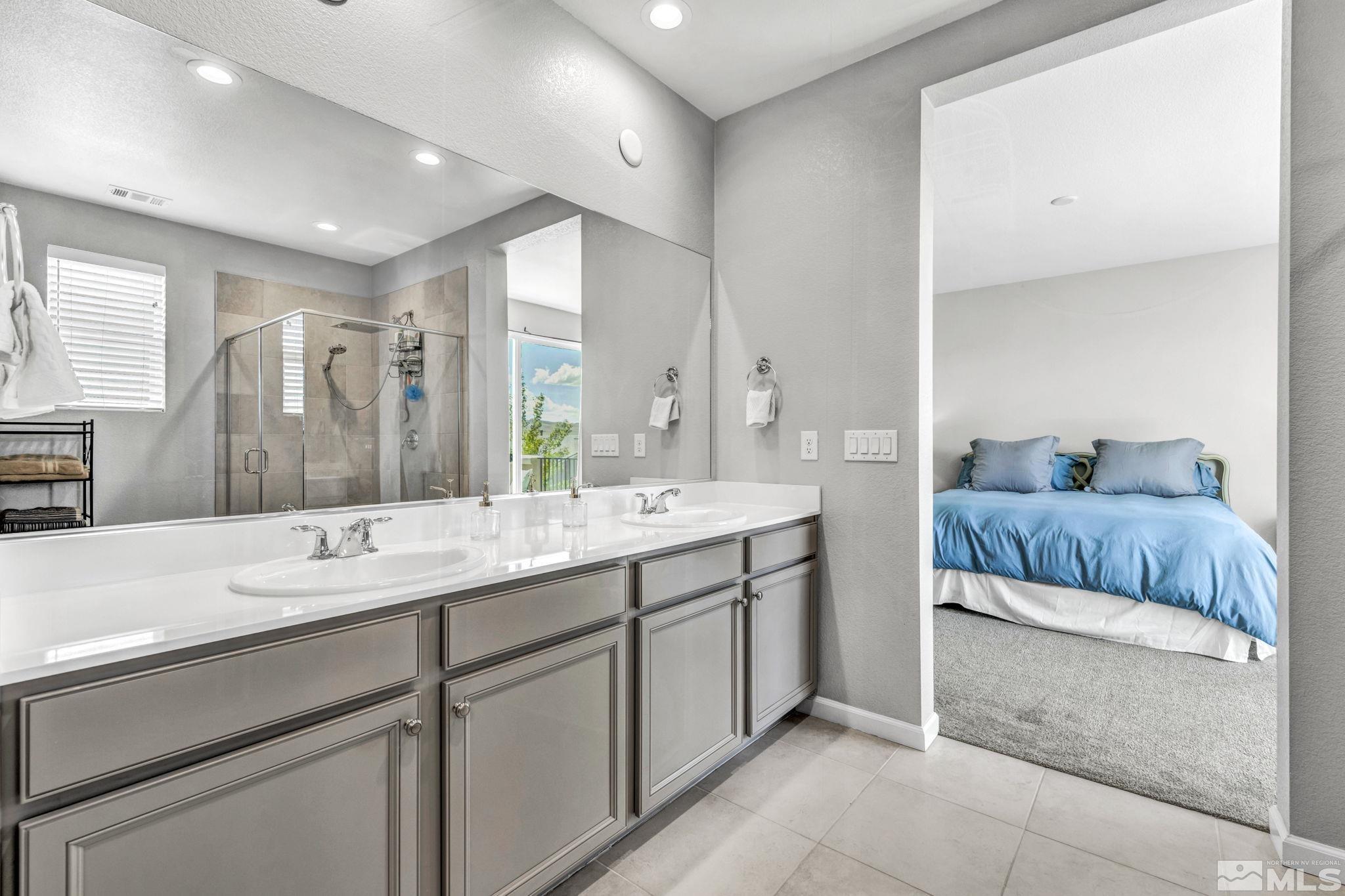 2265 Selway Drive Sparks, NV 89436 - Photo 20 of 39 a en suite bathroom with a double vanity sink and mirror