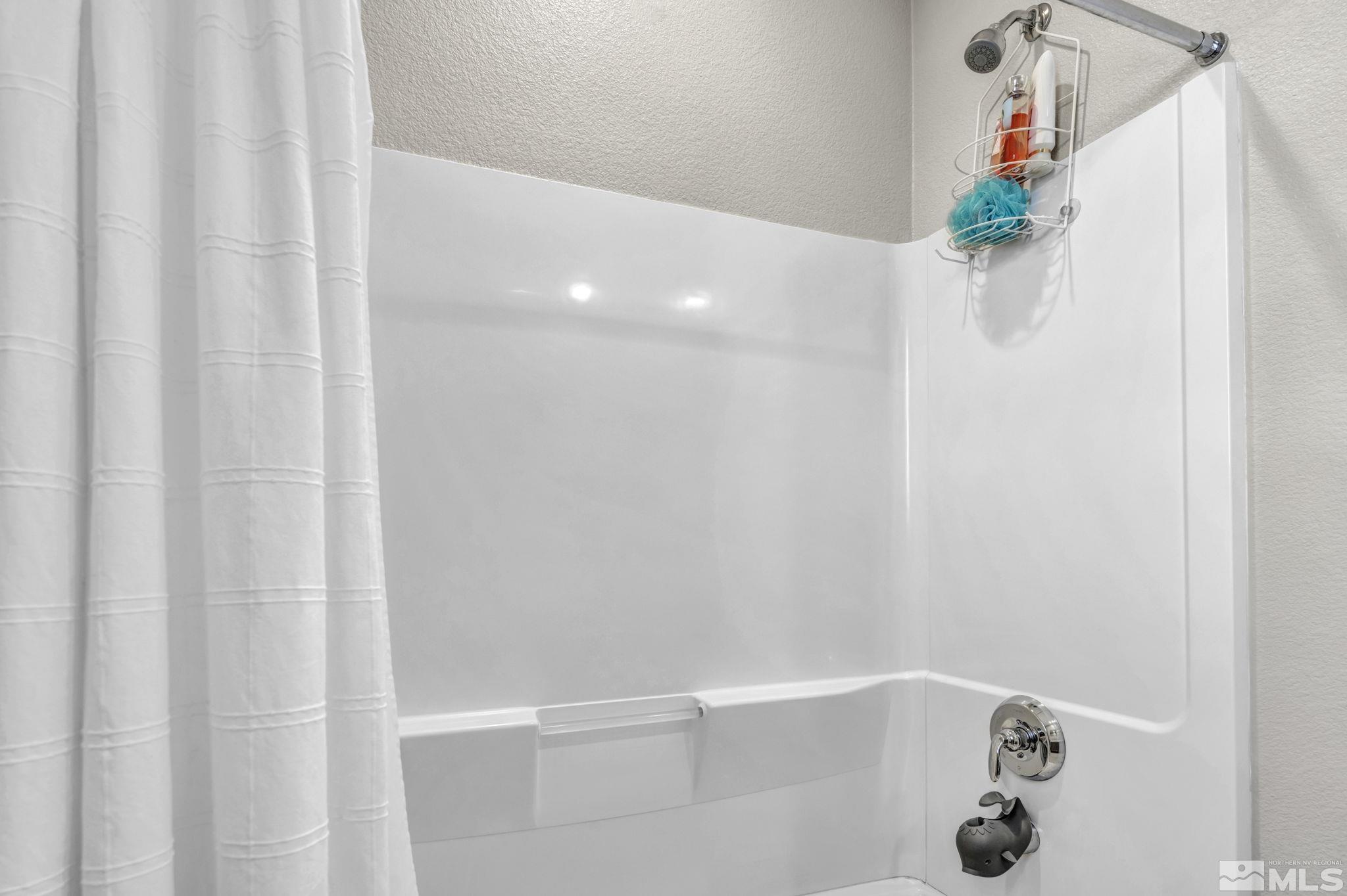 2265 Selway Drive Sparks, NV 89436 - Photo 24 of 39 a bathroom with a shower and a bath tub