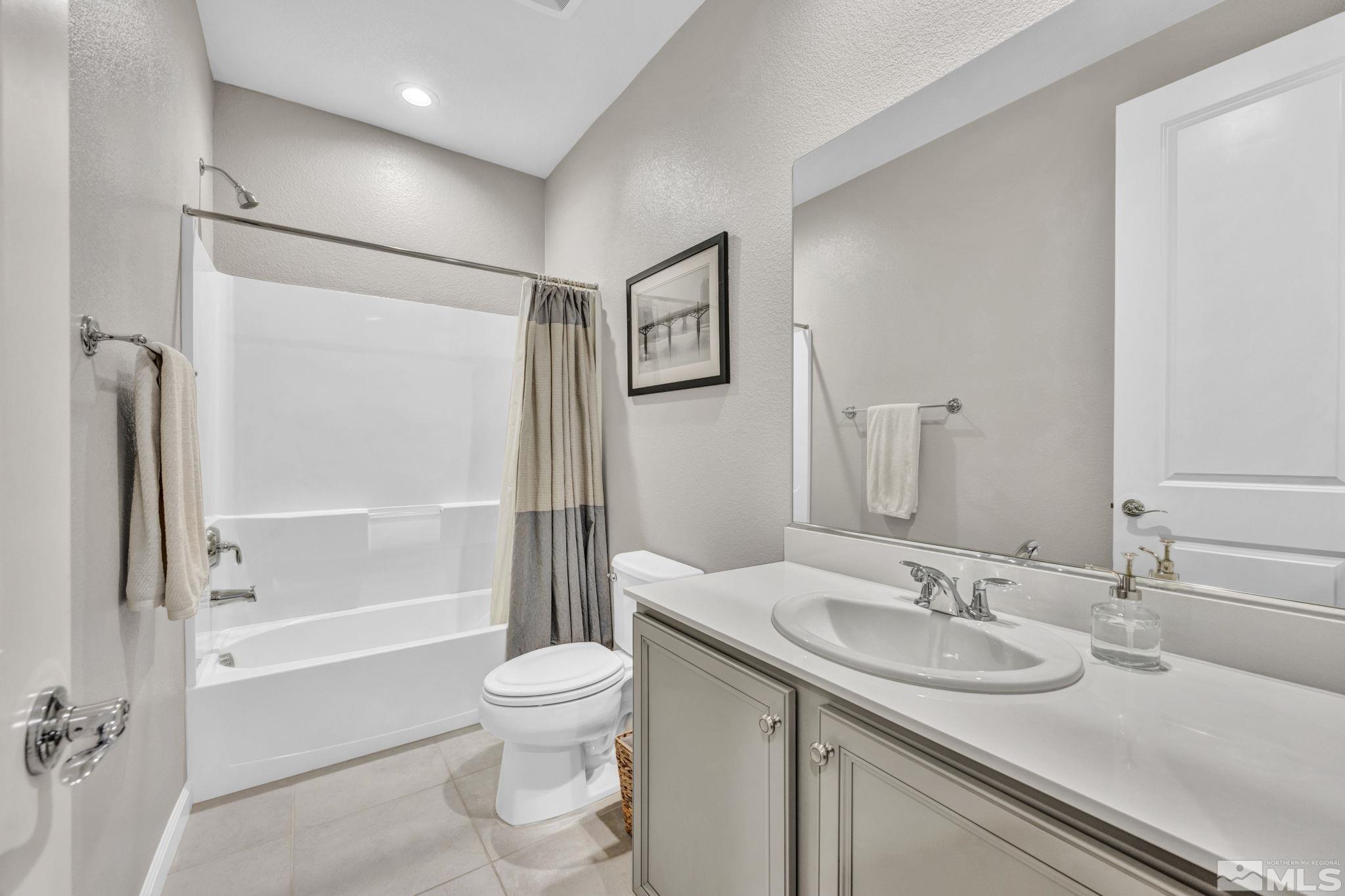 2265 Selway Drive Sparks, NV 89436 - Photo 26 of 39 a bathroom with a granite countertop sink toilet and shower