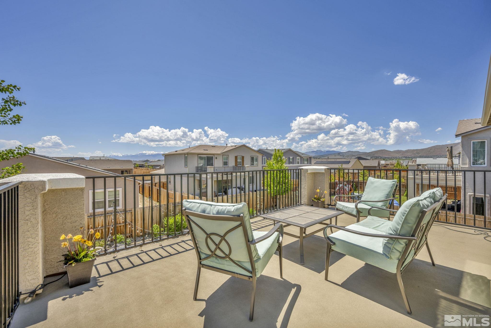 2265 Selway Drive Sparks, NV 89436 - Photo 32 of 39 a view of a patio with couches table and chairs and potted plants