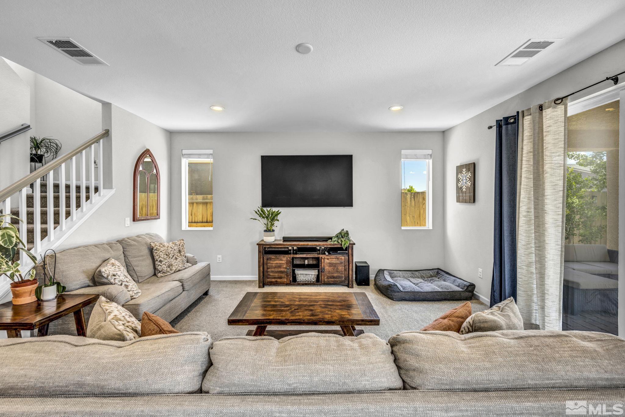 2265 Selway Drive Sparks, NV 89436 - Photo 6 of 39 a living room with furniture and a flat screen tv