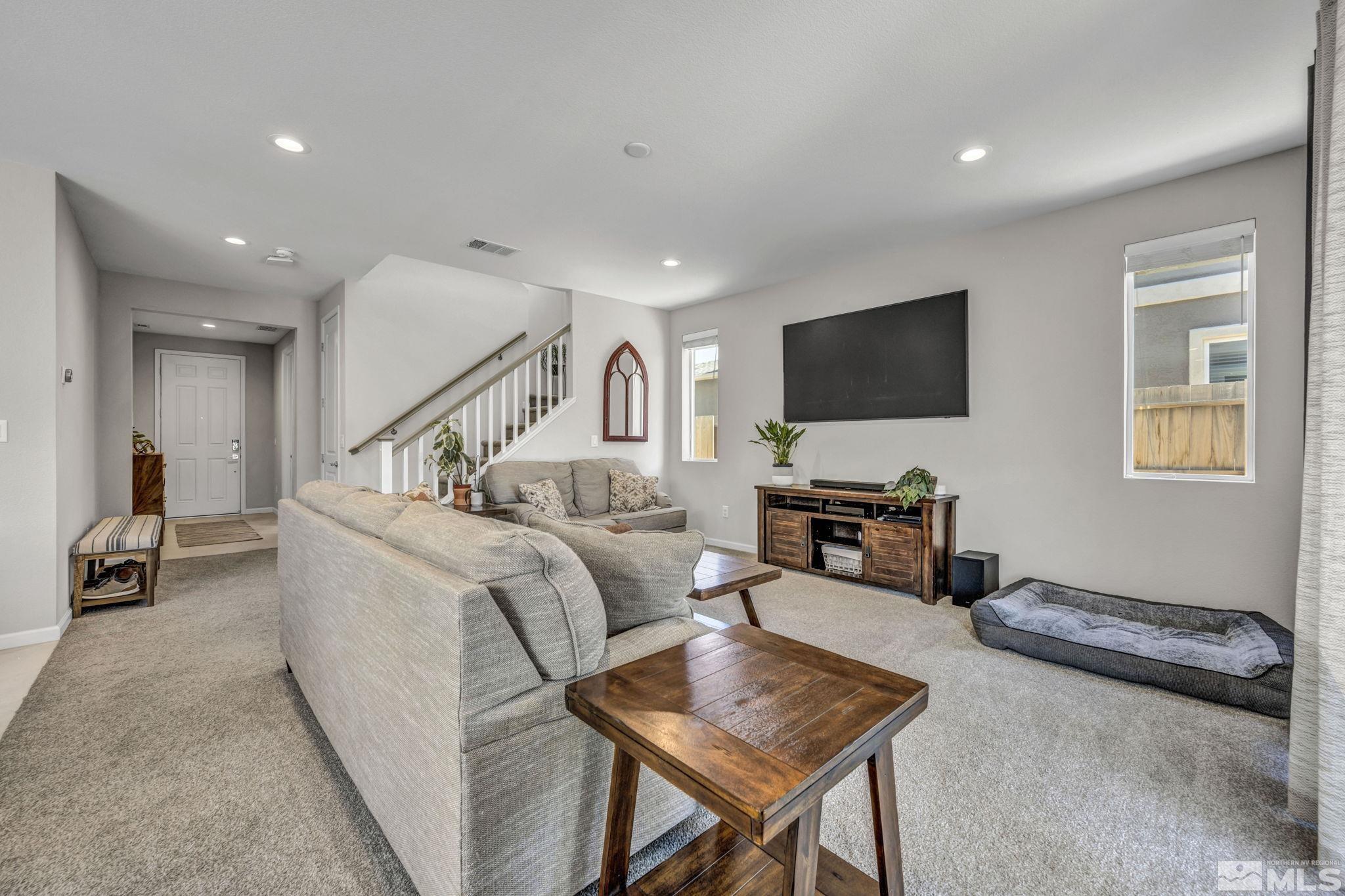 2265 Selway Drive Sparks, NV 89436 - Photo 7 of 39 a living room with furniture and a flat screen tv