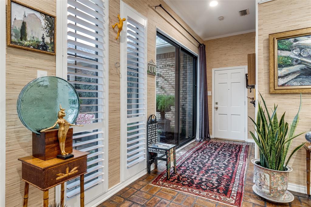 5723 Overdowns Drive Dallas, TX 75230 - Photo 16 of 36 a view of a hallway with furniture and a potted plant