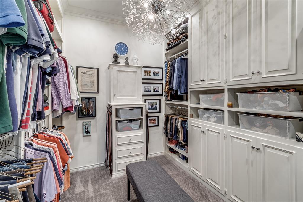 5723 Overdowns Drive Dallas, TX 75230 - Photo 24 of 36 a view of walk in closet with clothes