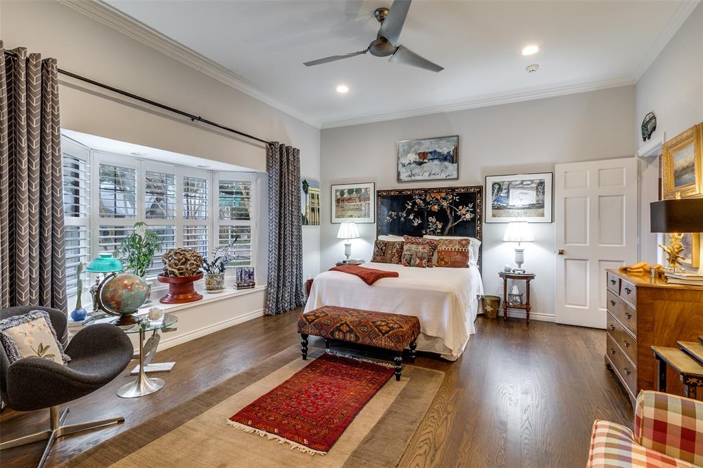 5723 Overdowns Drive Dallas, TX 75230 - Photo 25 of 36 a bedroom with a bed a large window and furniture