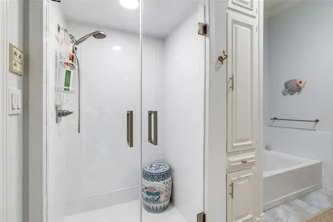 a view of a workspace with furniture and a fan