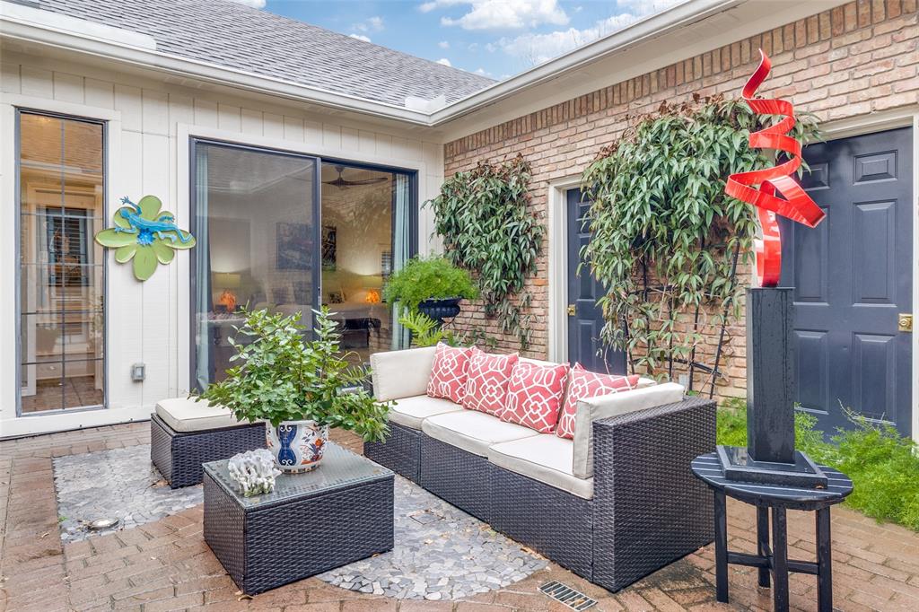 5723 Overdowns Drive Dallas, TX 75230 - Photo 31 of 36 a view of a patio with couches table and chairs and potted plants